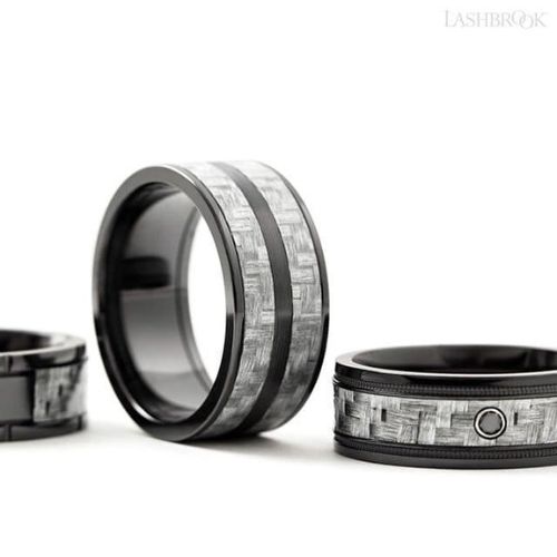 Black titanium men's wedding band featuring a silver texalium carbon fiber inlay.